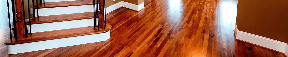 Base floor of a staircase with professionally restored wood flooring in Jacksonville FL