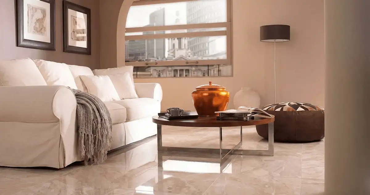 Modern living room with professionally installed marble flooring, a beige sofa, coffee table in Jacksonville, FL