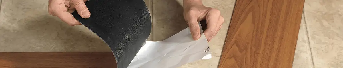 A professional installing vinyl flooring in Jacksonville, FL