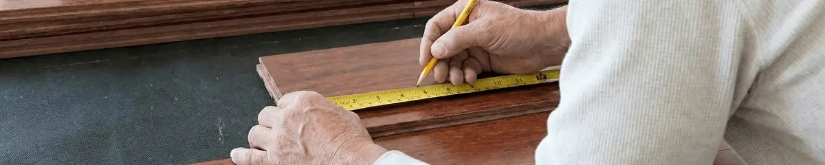 A professional installing wood flooring in Jacksonville, FL
