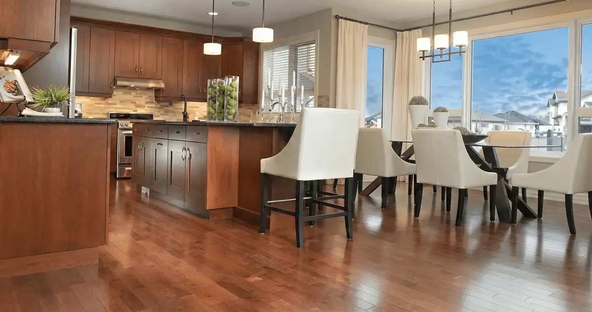 A modern kitchen with professionally installed wood flooring in Jacksonville, FL